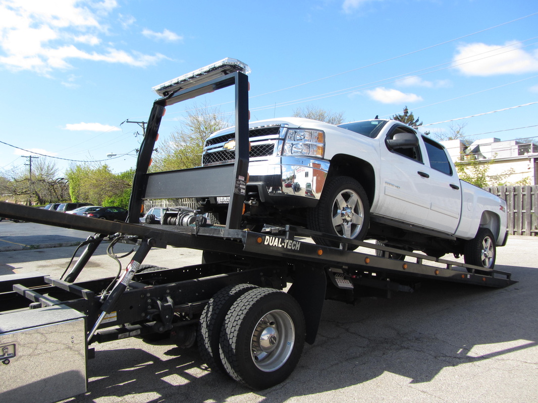 Tow truck loading a vehicle